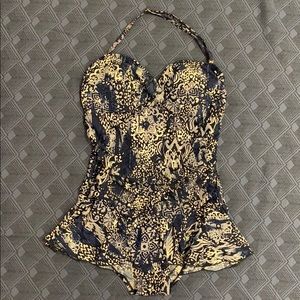 One-piece skirted bathing suit.